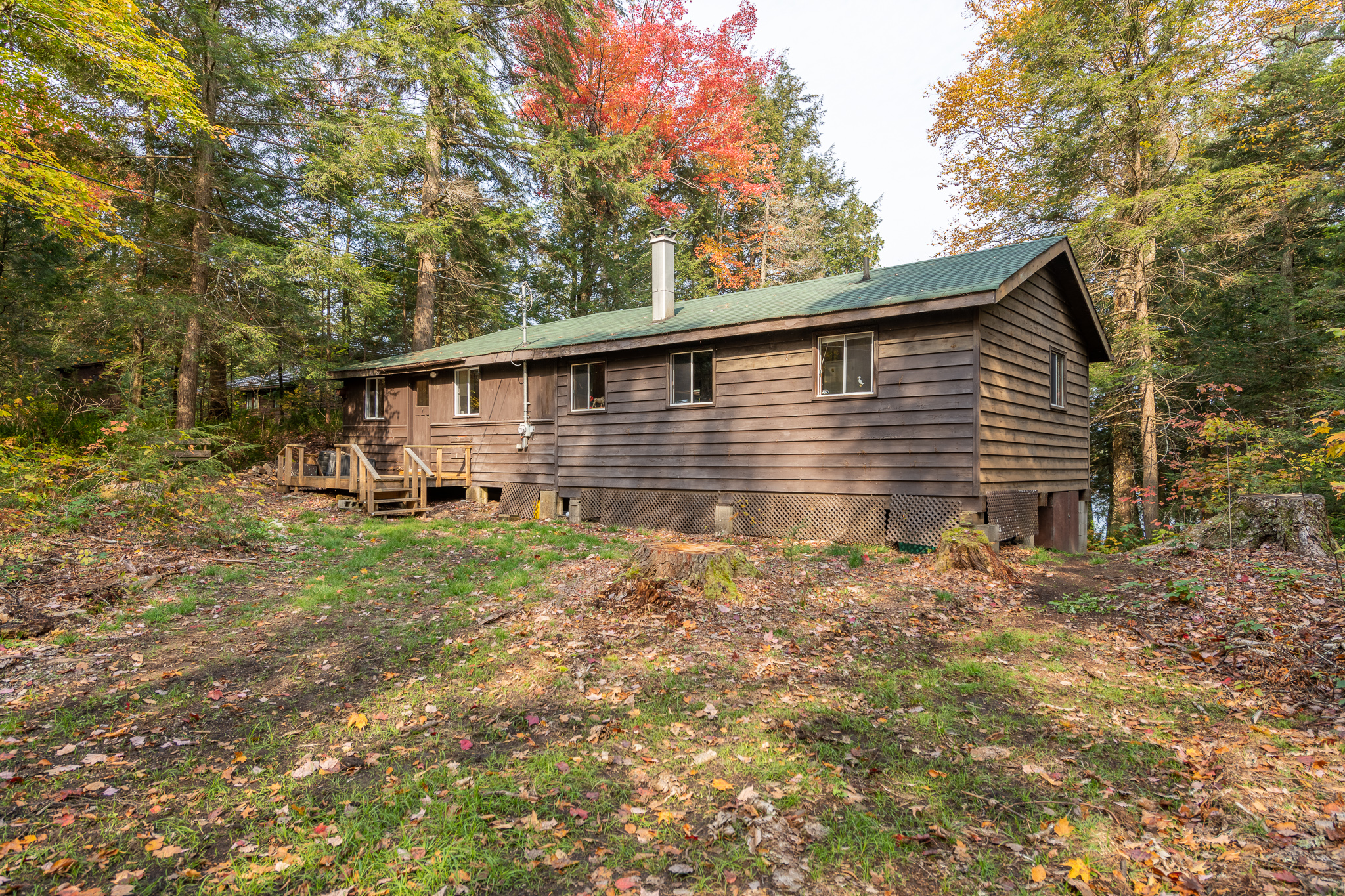 A brown bungalow cabin in the woods