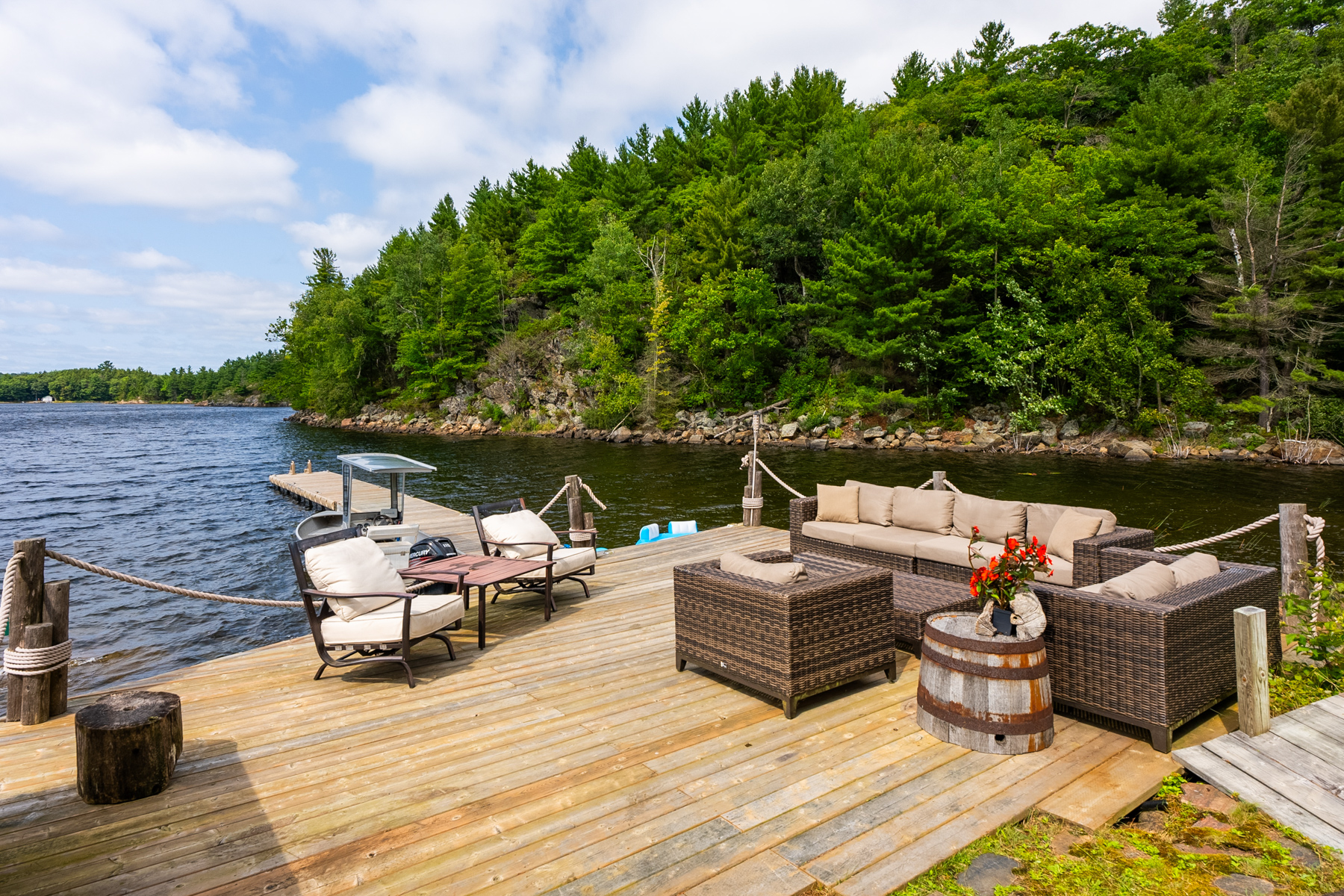 Patio furniture on a lakeside deck
