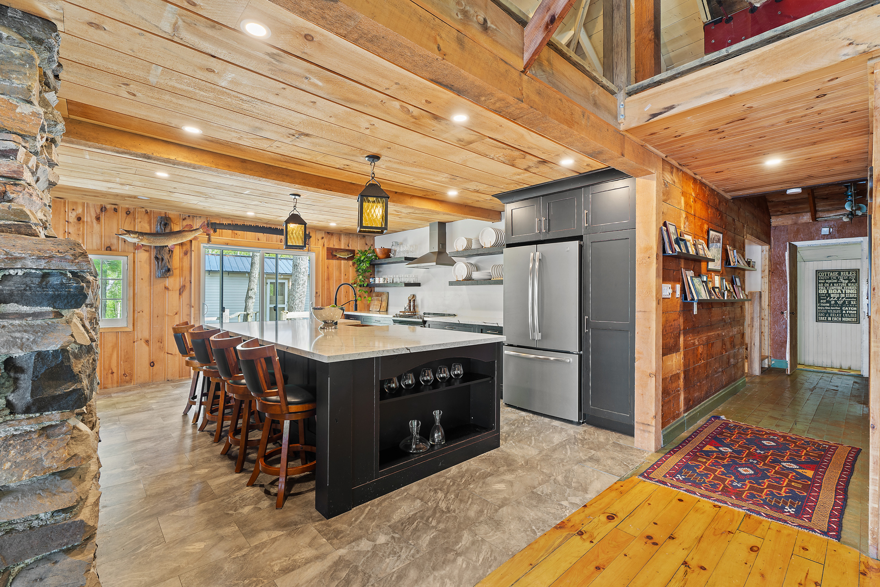 A large black kitchen island with white countertops