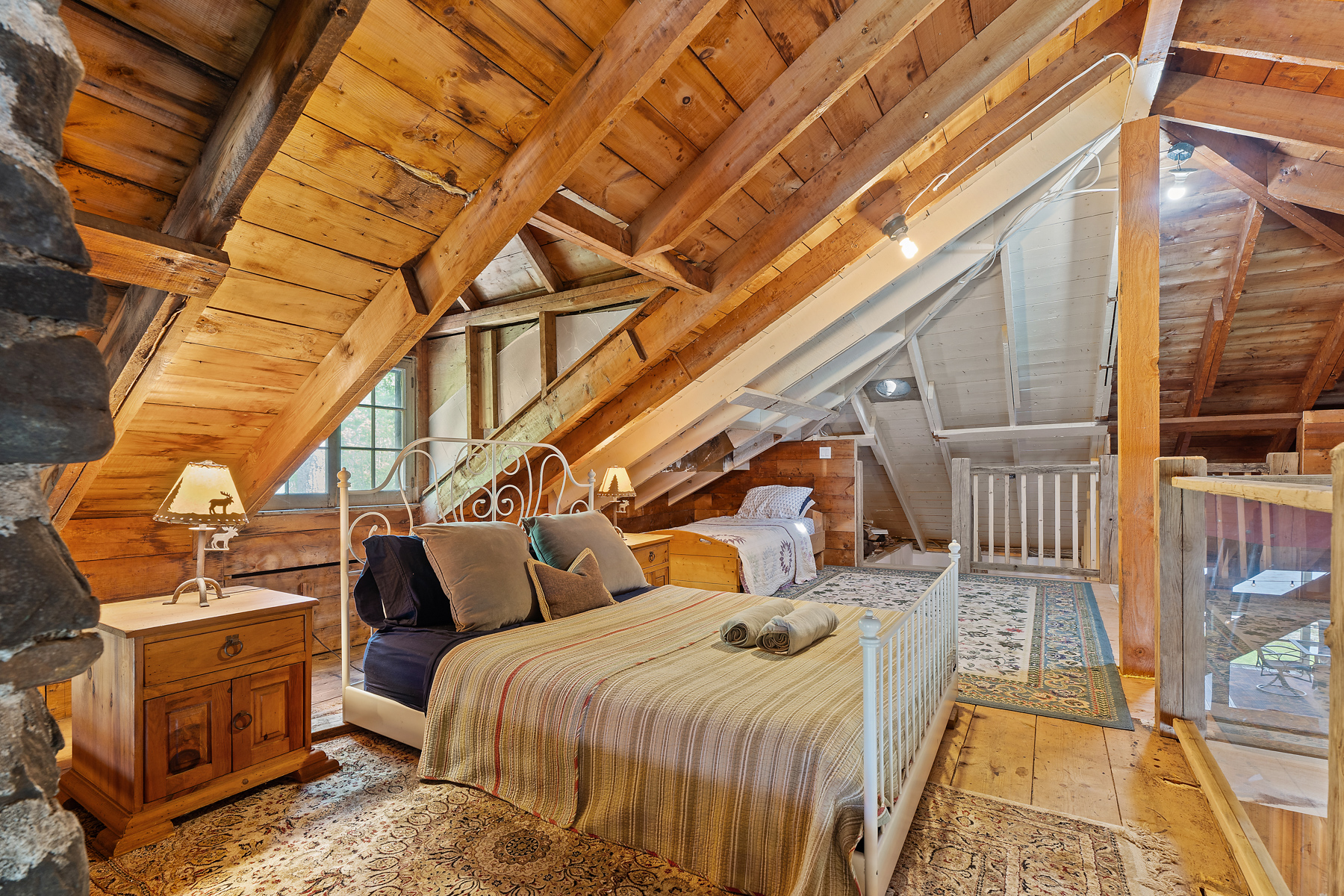 The side of a striped bed in a loft