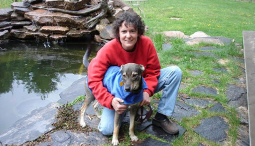 a photo of a woman and a dog outside