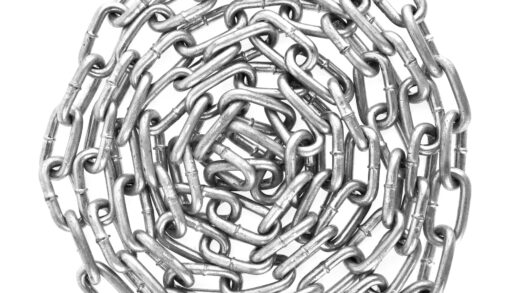 A coil of chain against a white background