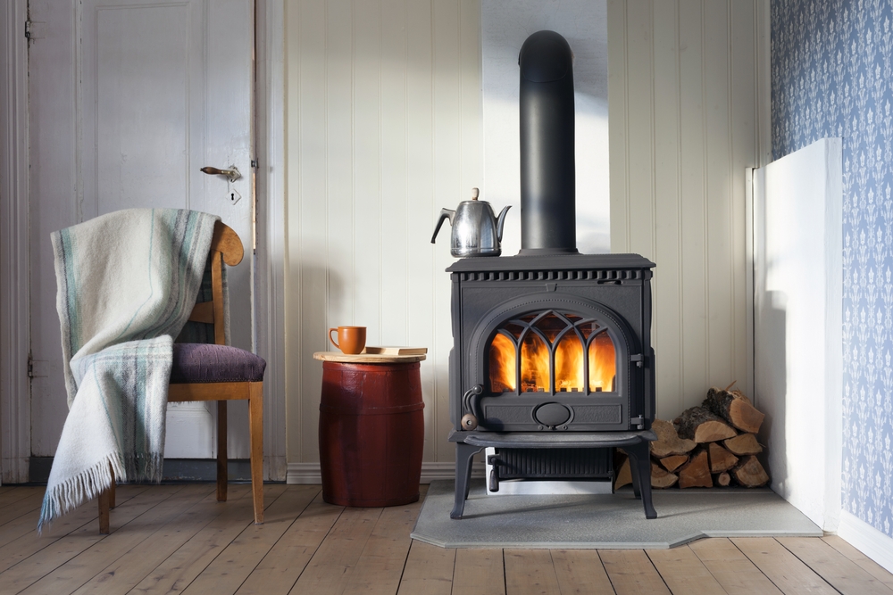 A wood-burning stove inside a cabin