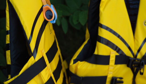 Two yellow lifejackets hanging up