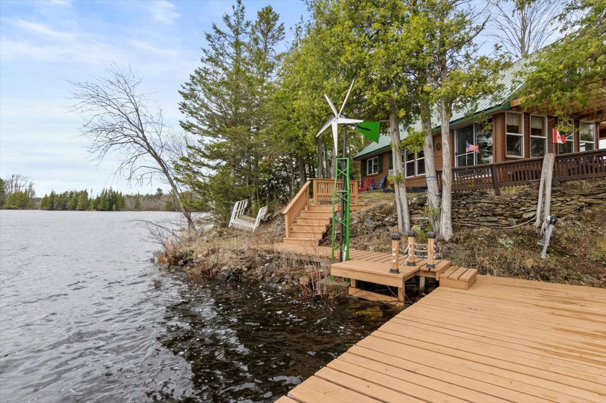 Wood steps lead down to a wood dock