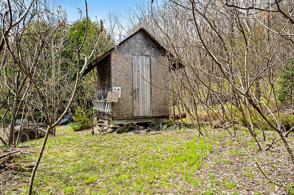 a photo of an outdoor storage shed