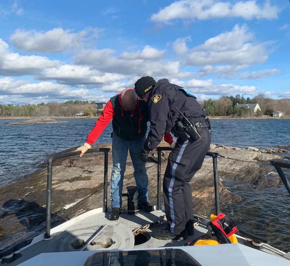 OPP rescue the man who was stuck on a shoal after going overboard into Georgian Bay. You can see his brightly coloured PFD in the corner of the photo
