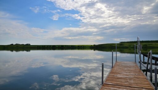 A wood and aluminum dock in the water