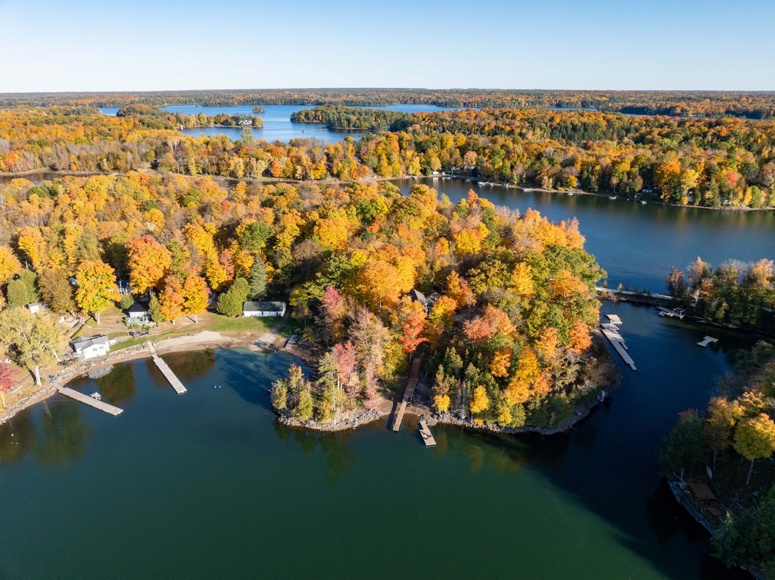 Aerial view of cottage island with autumn trees