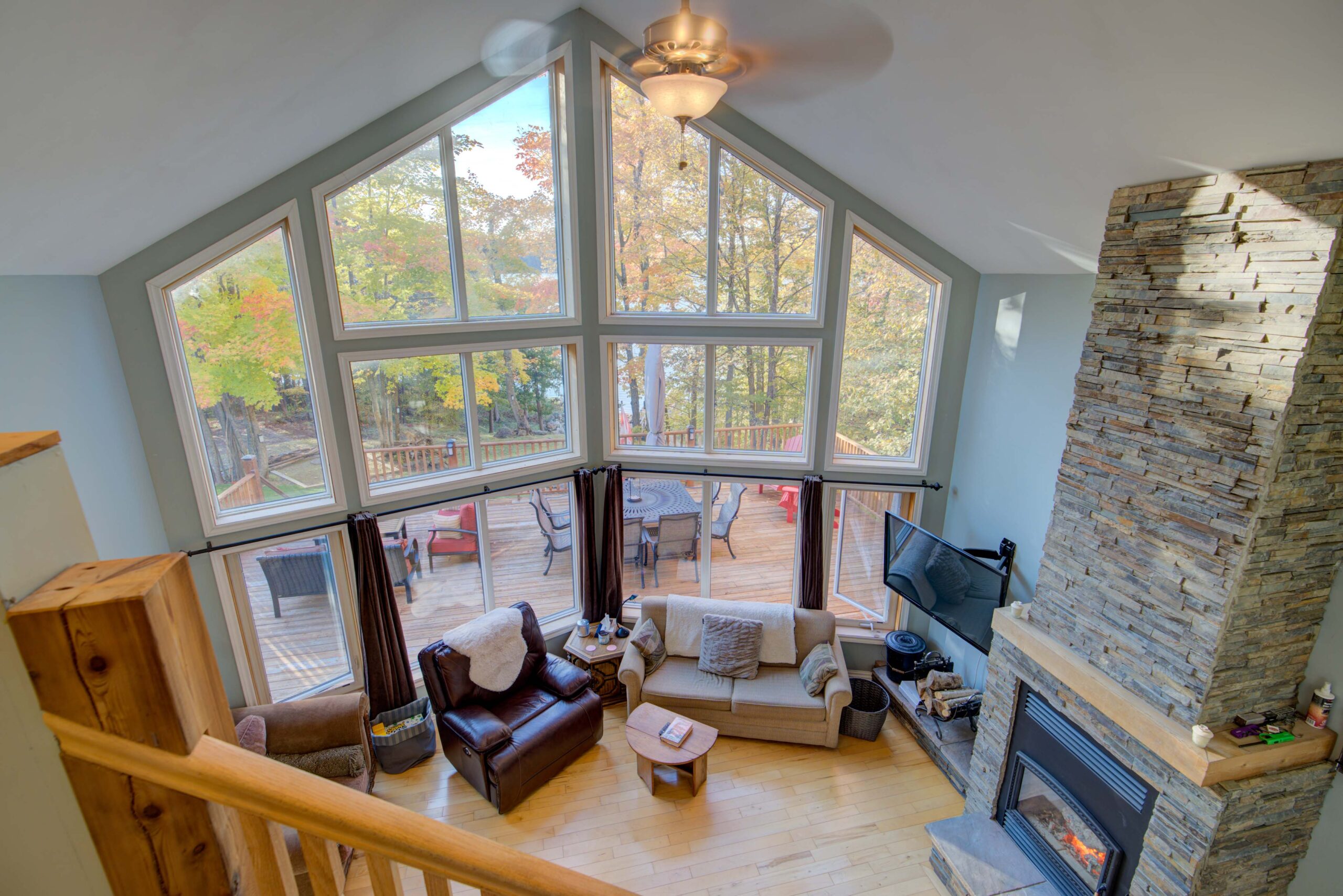 From above, A staircase with grey steps in a huge living room