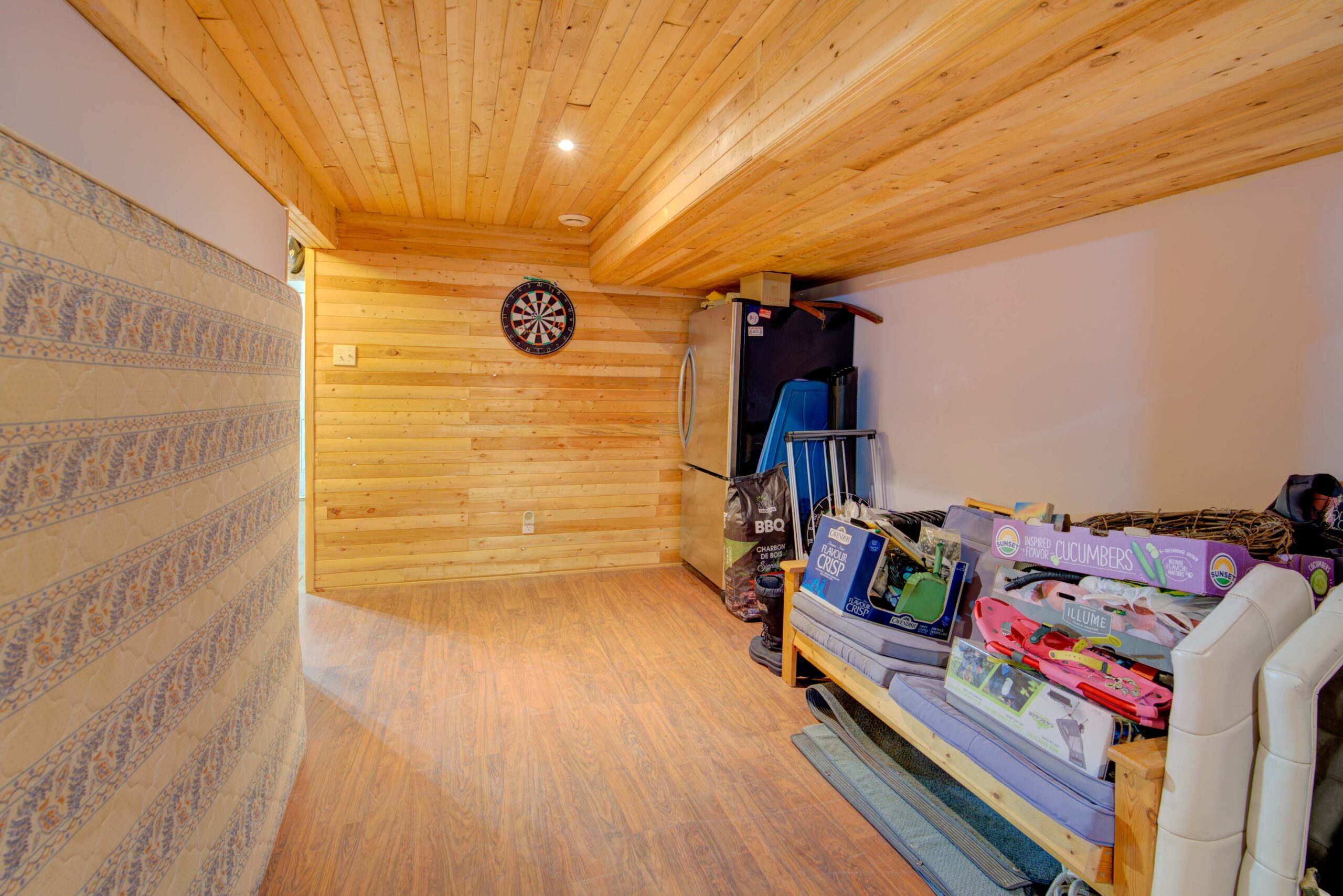 A narrow room with wood panelling throughout