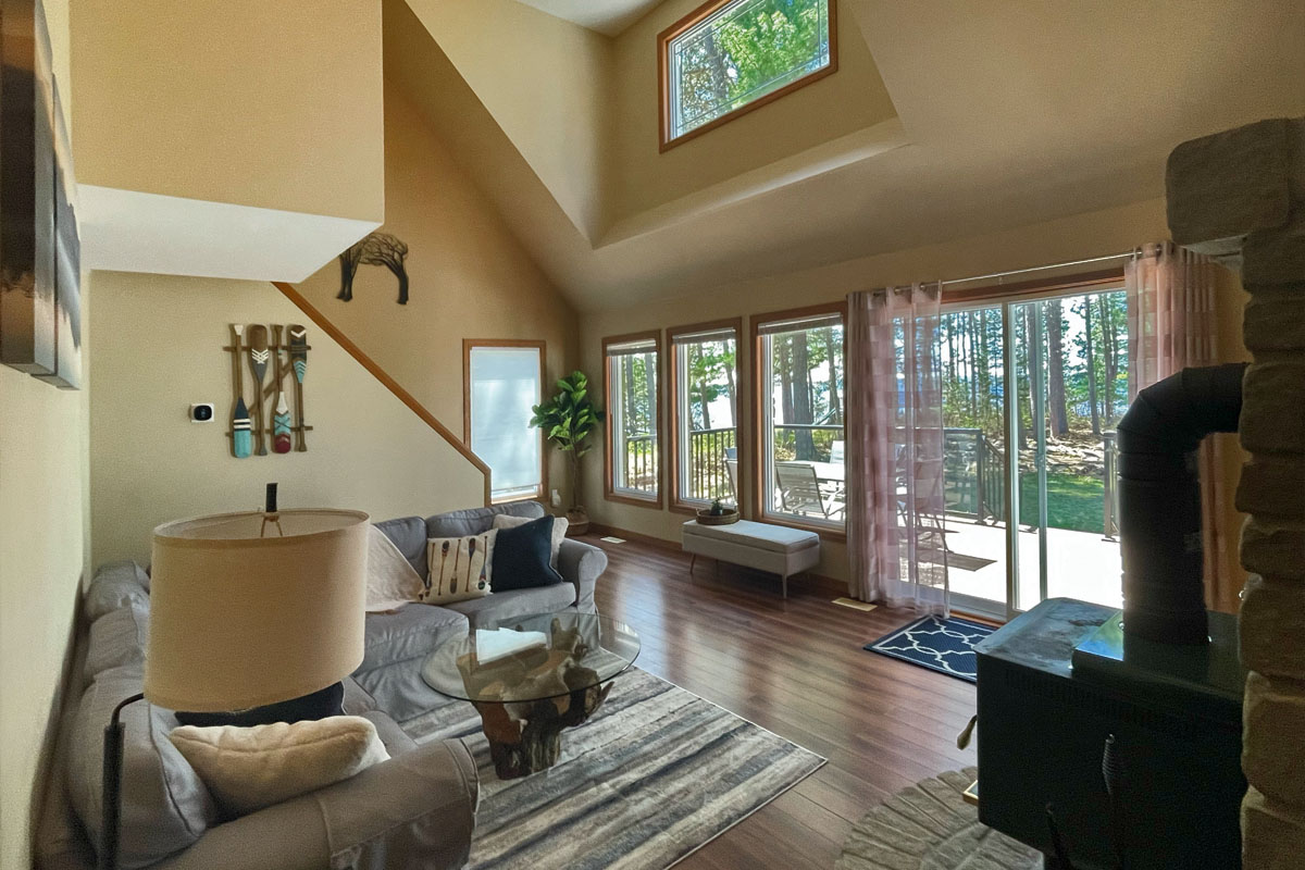 a photo of an open-concept cottage living room