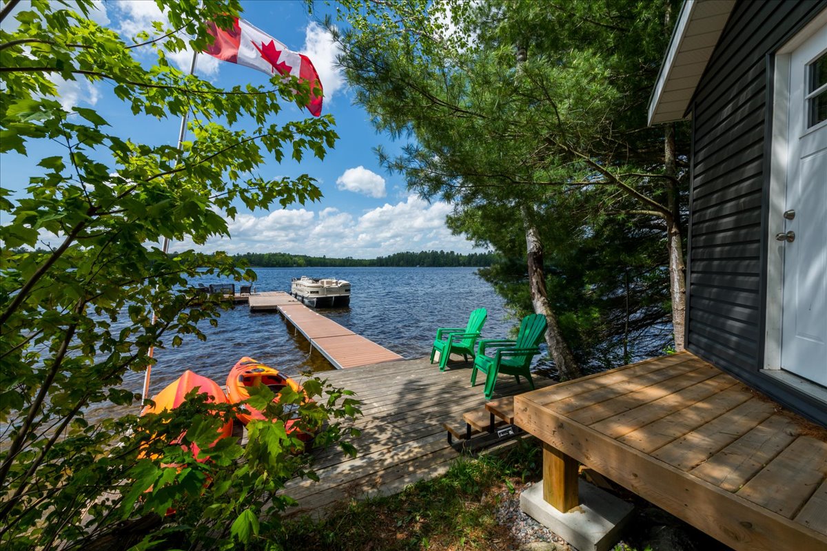 A long dock juts out into the lake