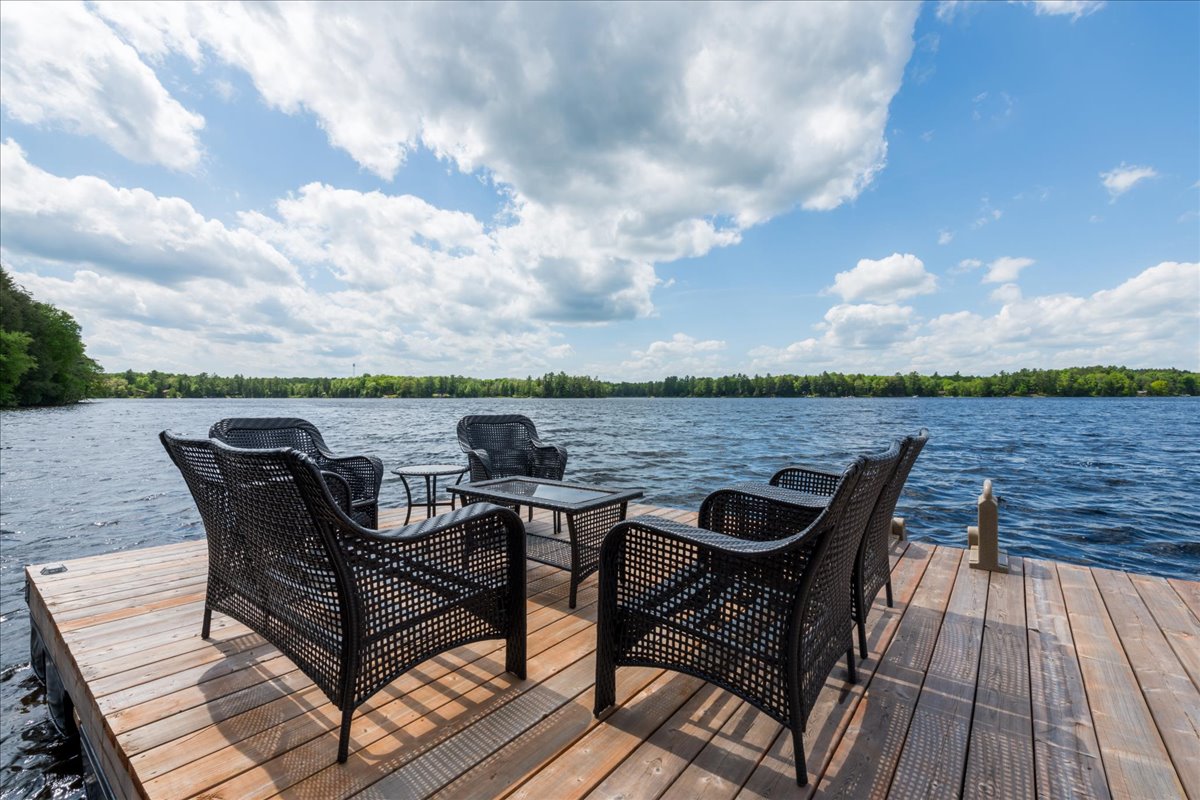 A patio set at the end of a dock