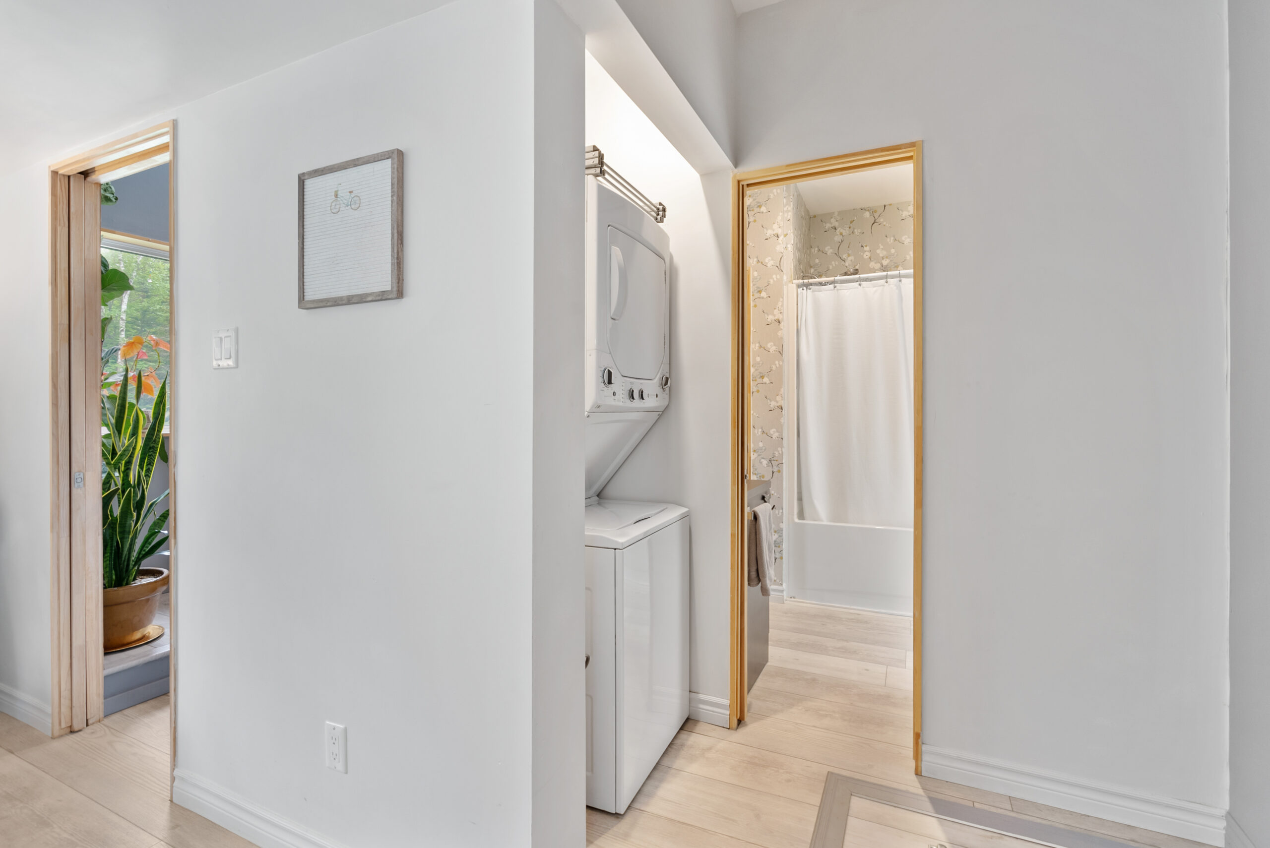 Stacked laundry machines in a white room