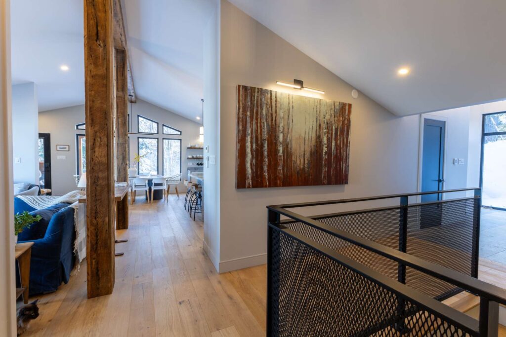 A bright hallway opens into a living room
