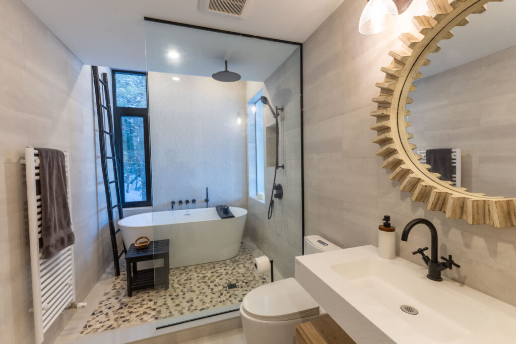 A freestanding tub inside a glass shower