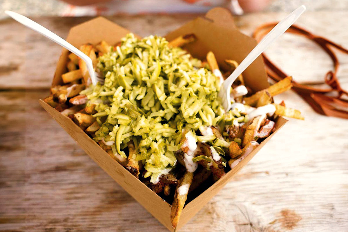 a photo of a cardboard container with fries in it