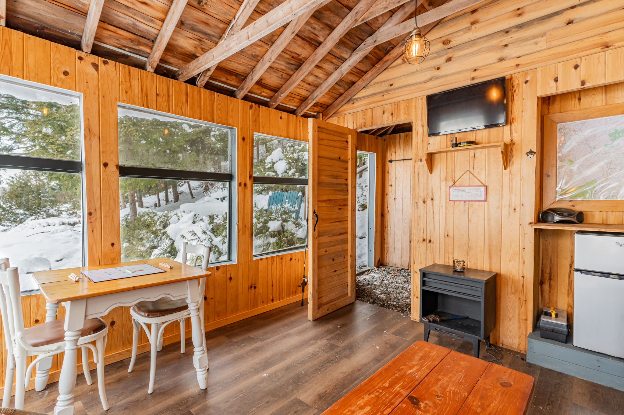 A wood room with large glass windows