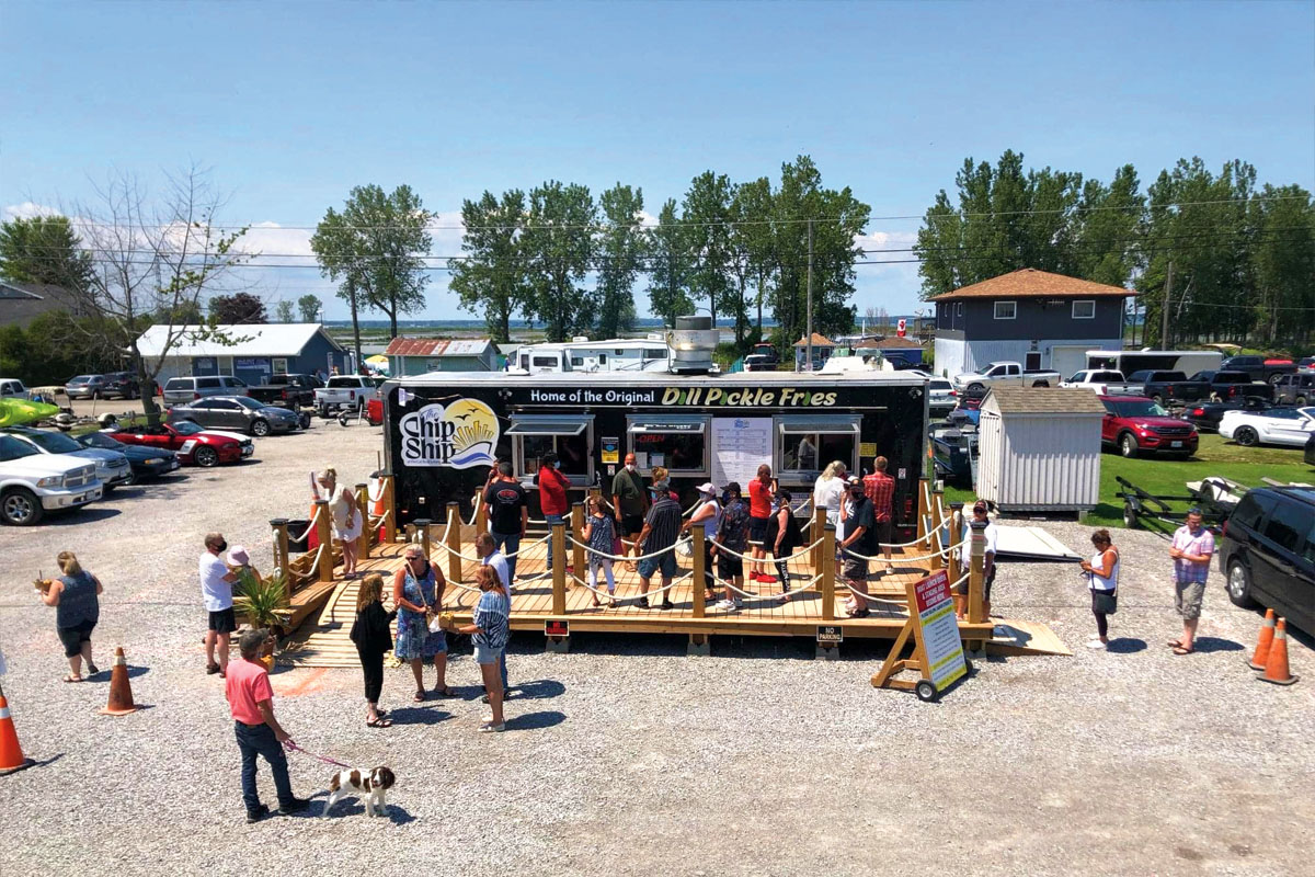 a photo of a chip truck with a line of customers out front