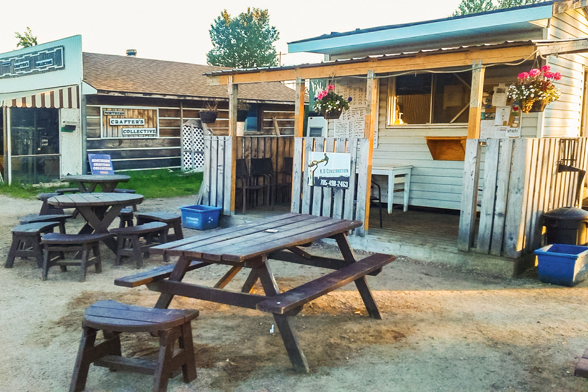 a photo of a chip truck with a picnic table out front