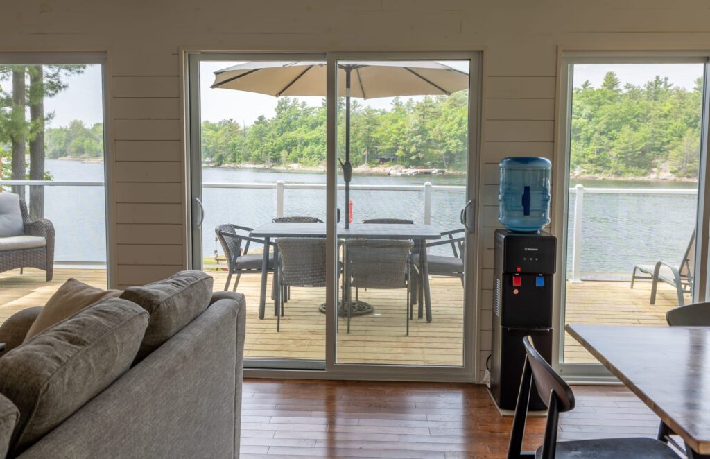 Glass sliding doors open to a back with