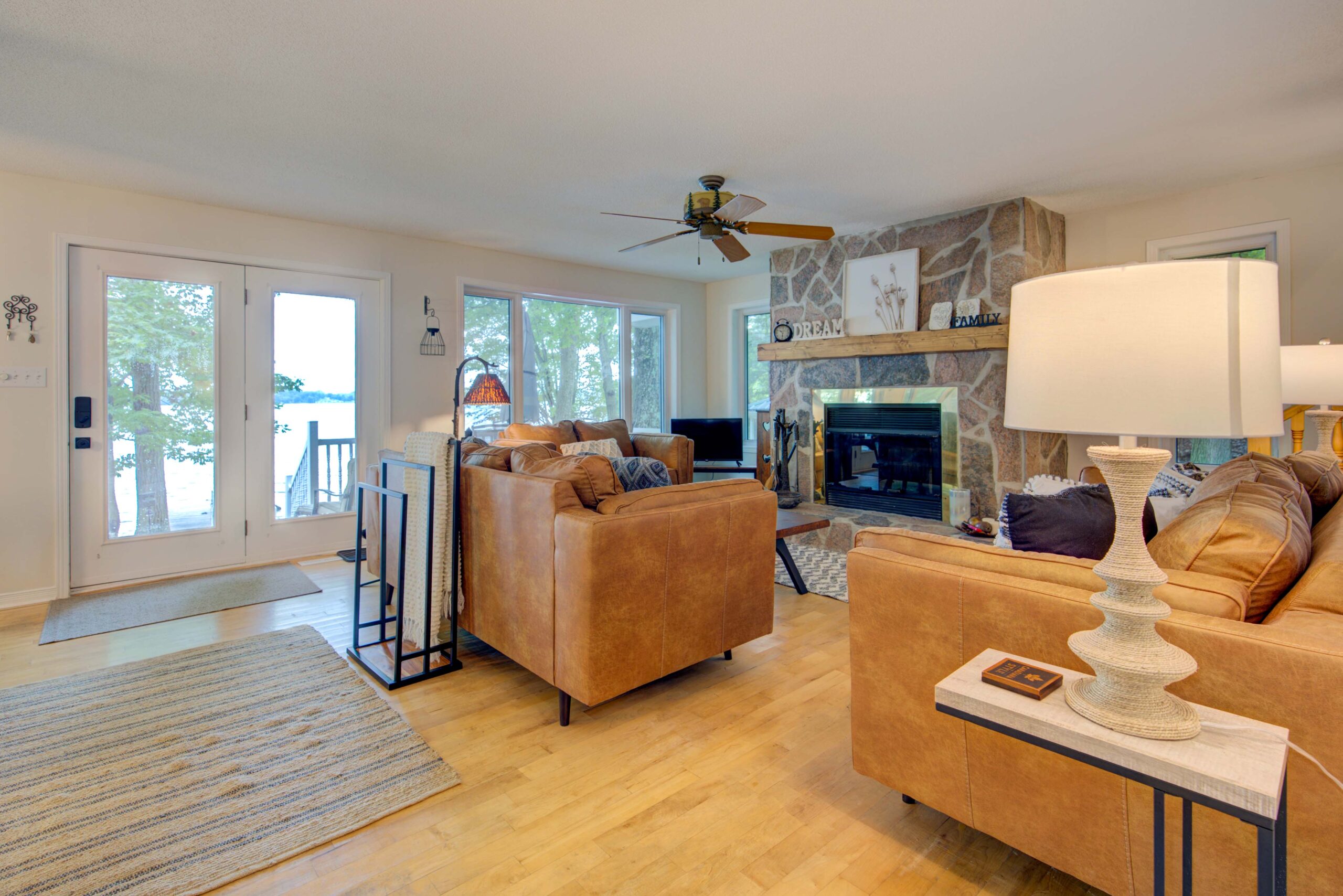 A white kitchen with black appliances