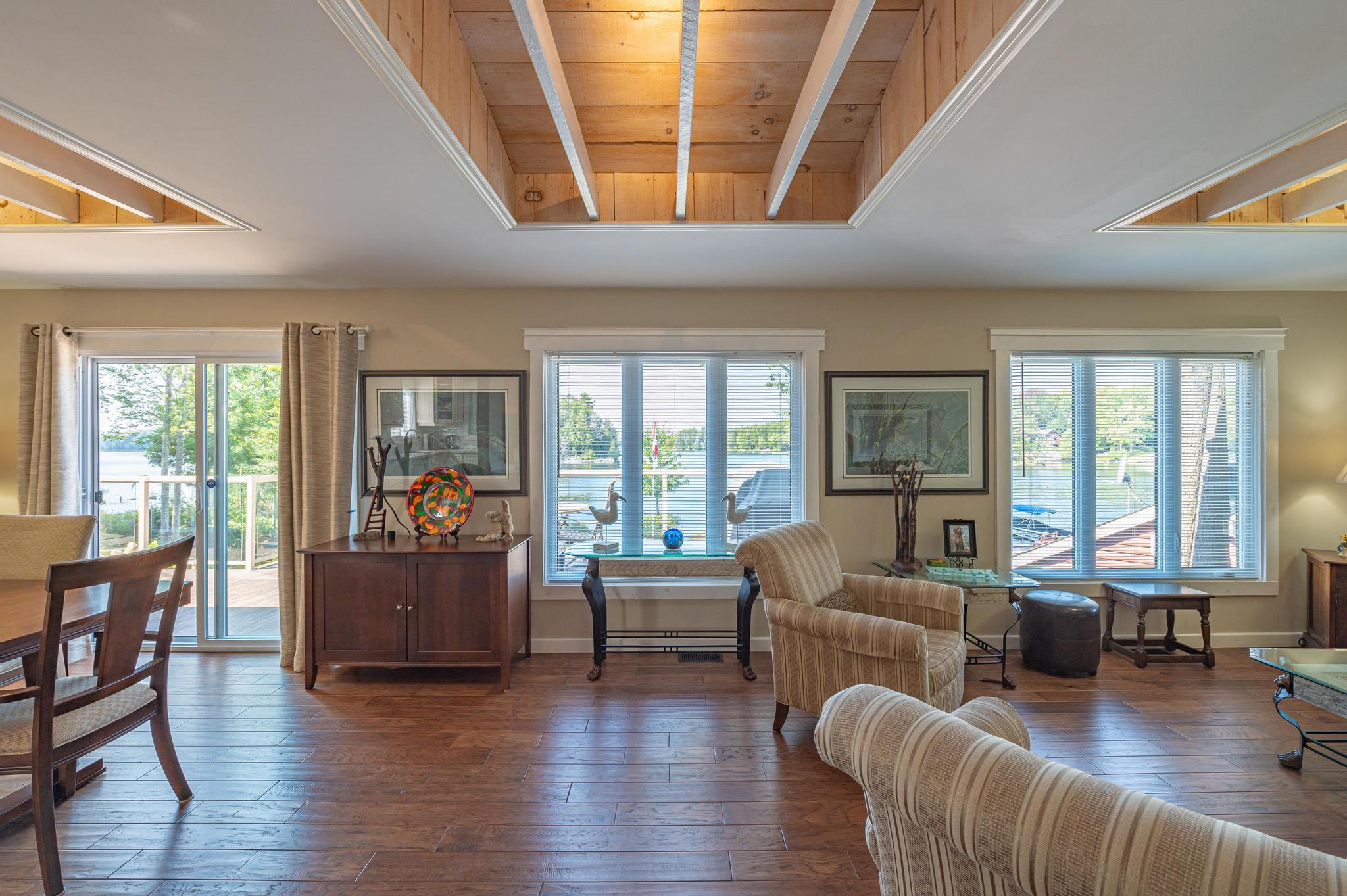 A large living room featuring a cozy fireplace and comfortable seating.
