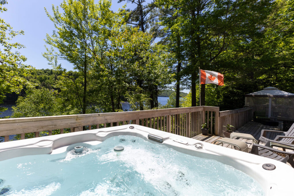 A bubbling hot top on a deck looking out into a forest