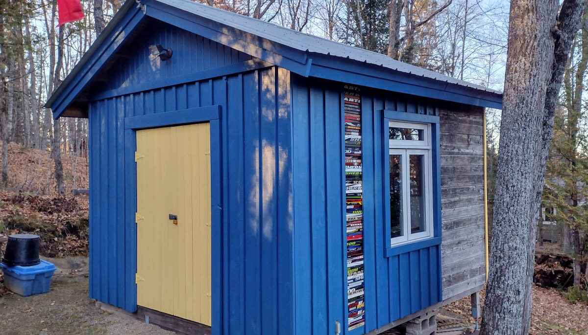 Blue and yellow cottage shed.