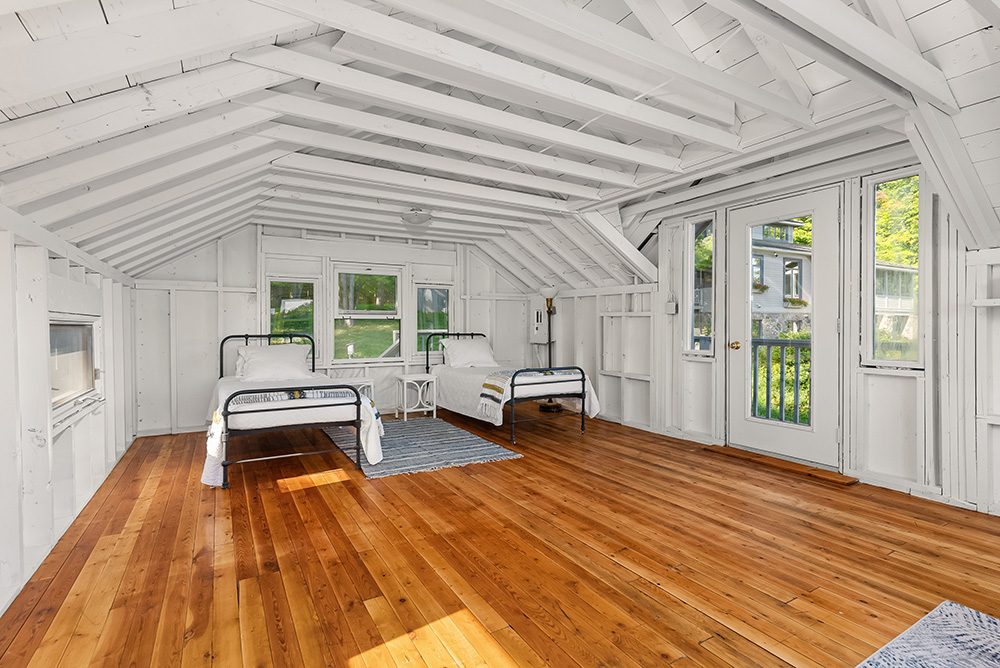 Spacious upper level of the boathouse with wood floors and natural light