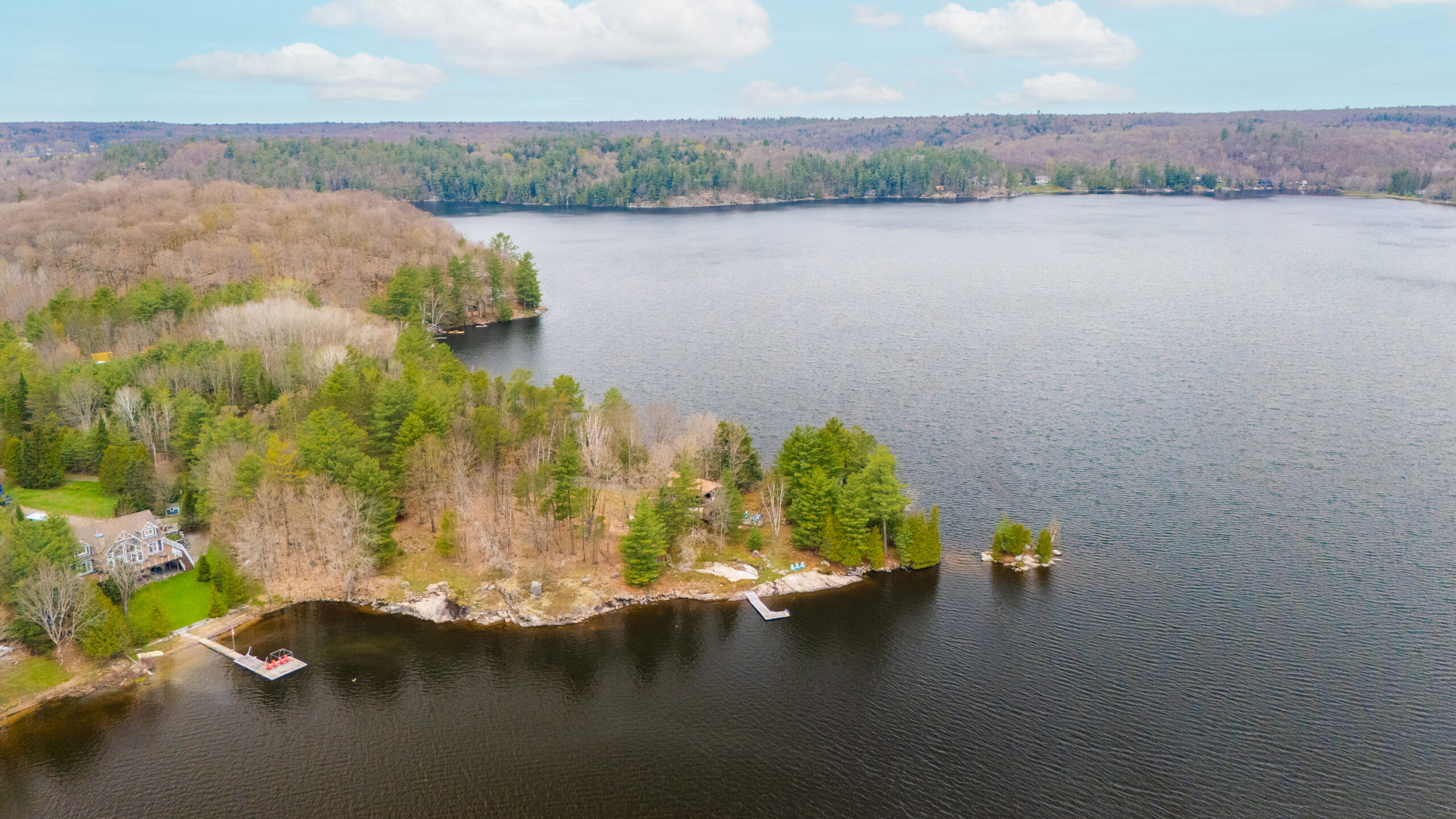 Inlet on Three Mile Lake with cottages and docks.
