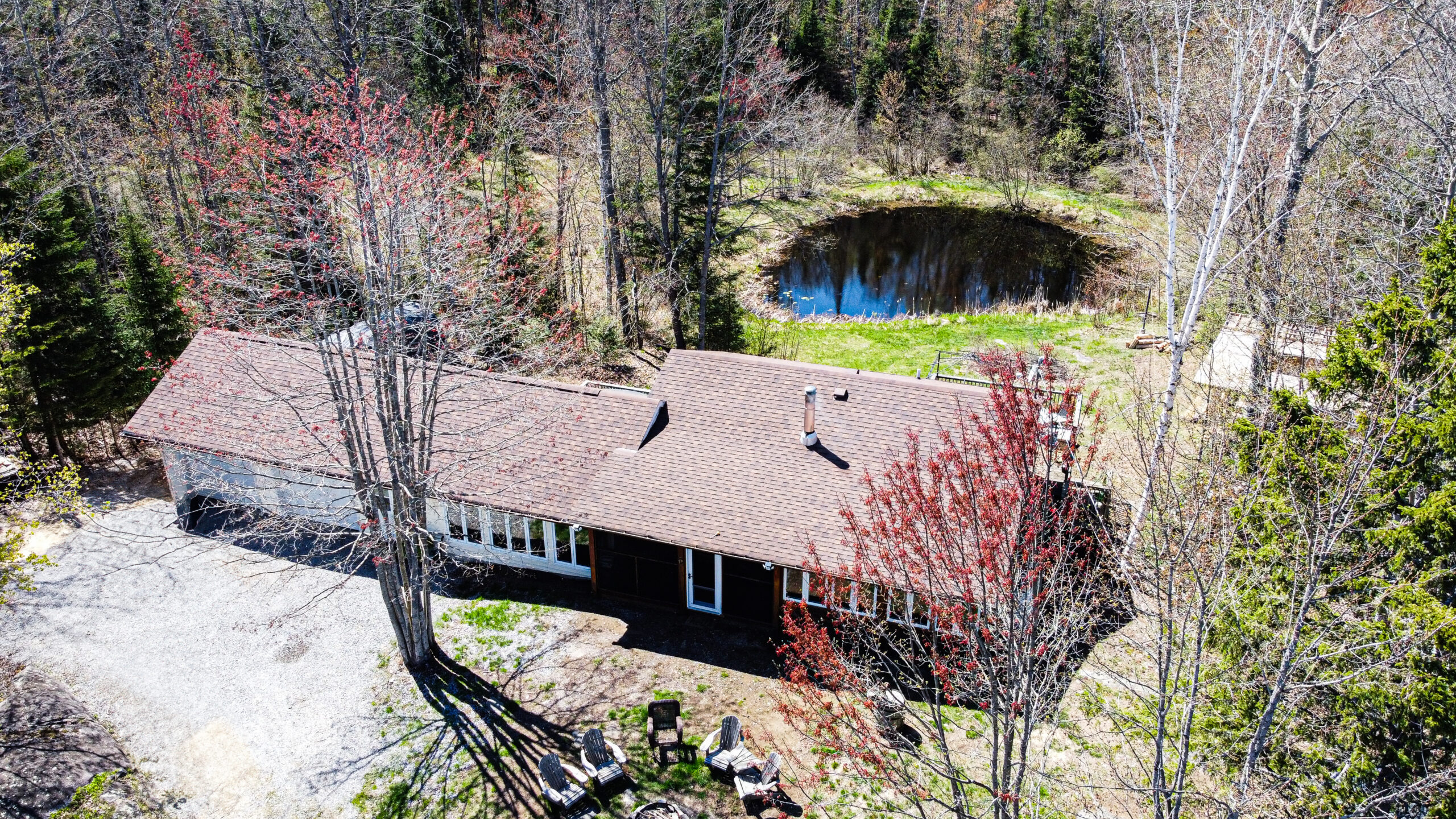 A bungalow cottage on a spacious property with a pond behind