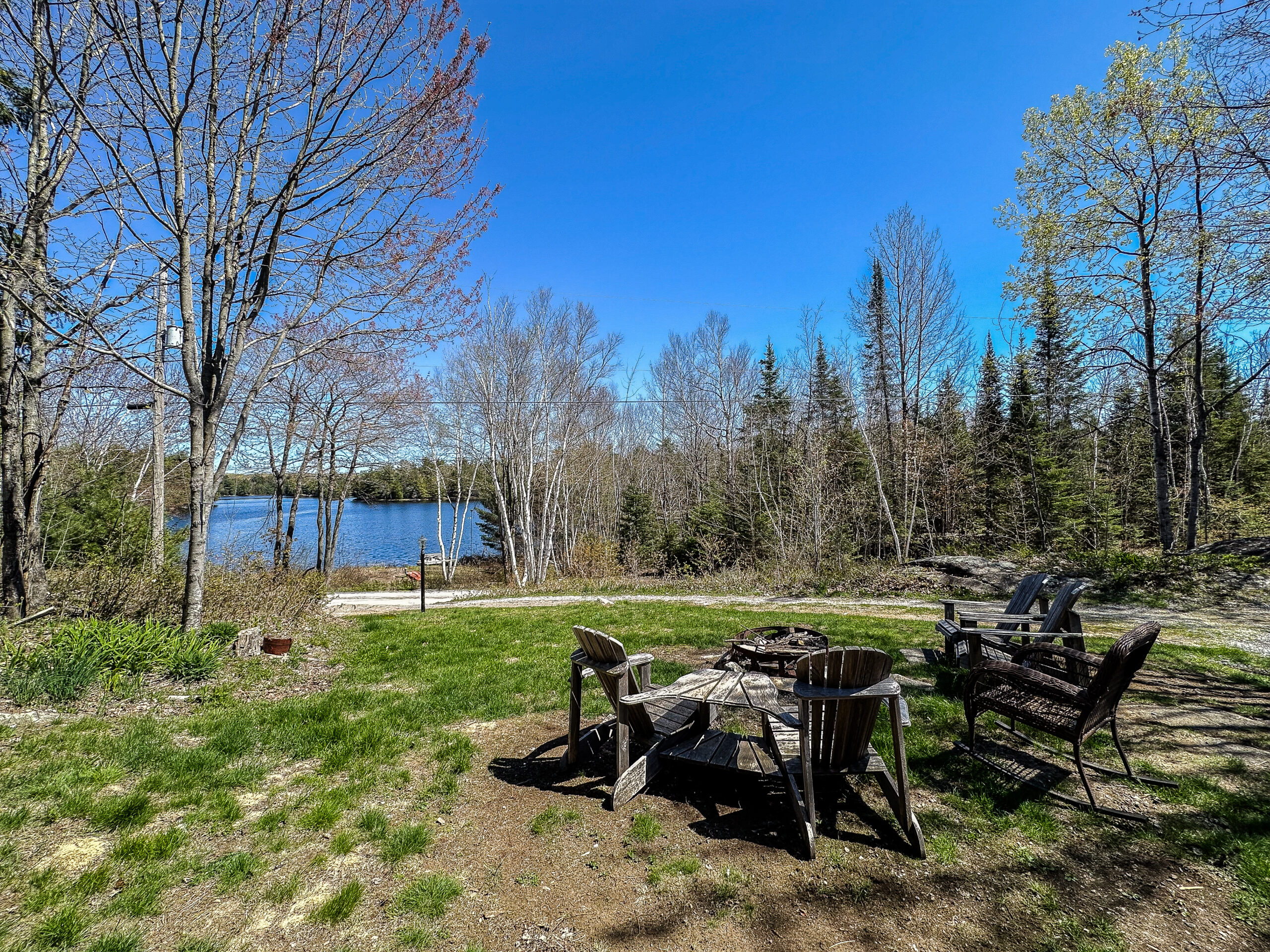 A fire pit area faces the lake