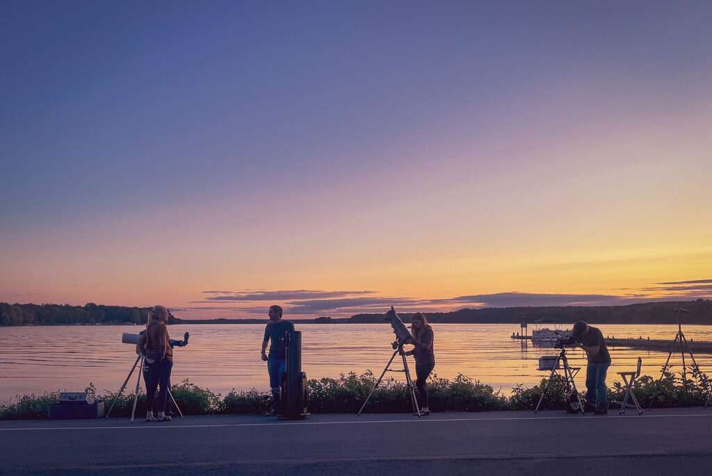A group of stargazers gather to observe the sky