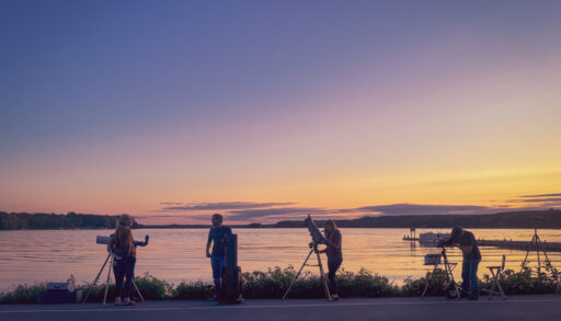 A group of stargazers gather to observe the sky