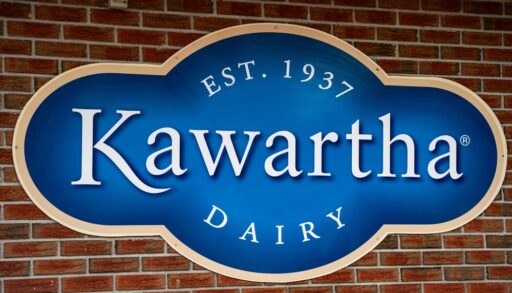 Kawartha Dairy company logo sign on a brick wall