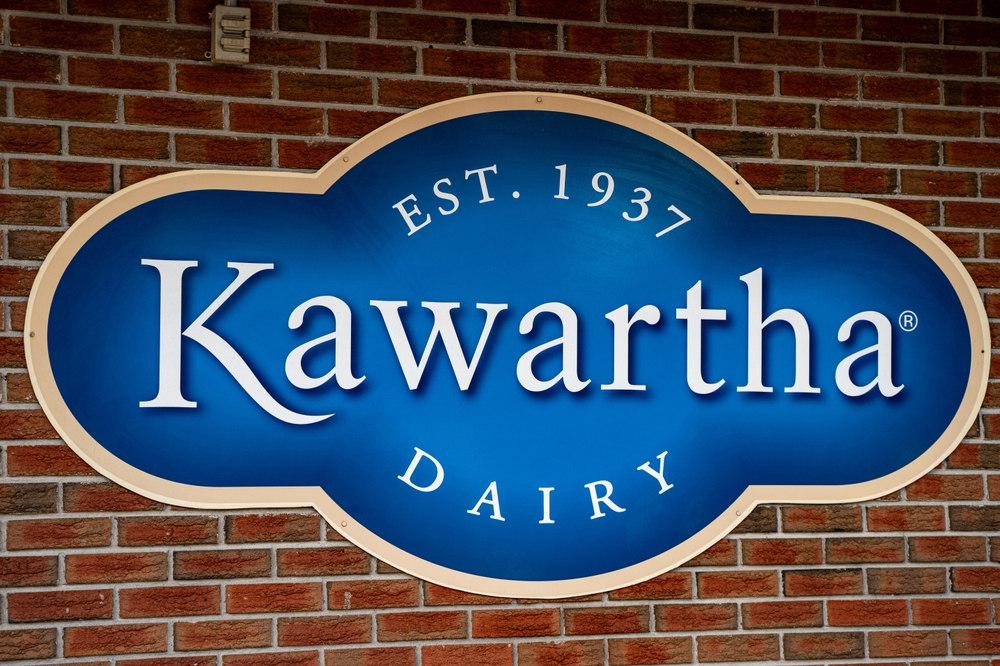 Kawartha Dairy company logo sign on a brick wall