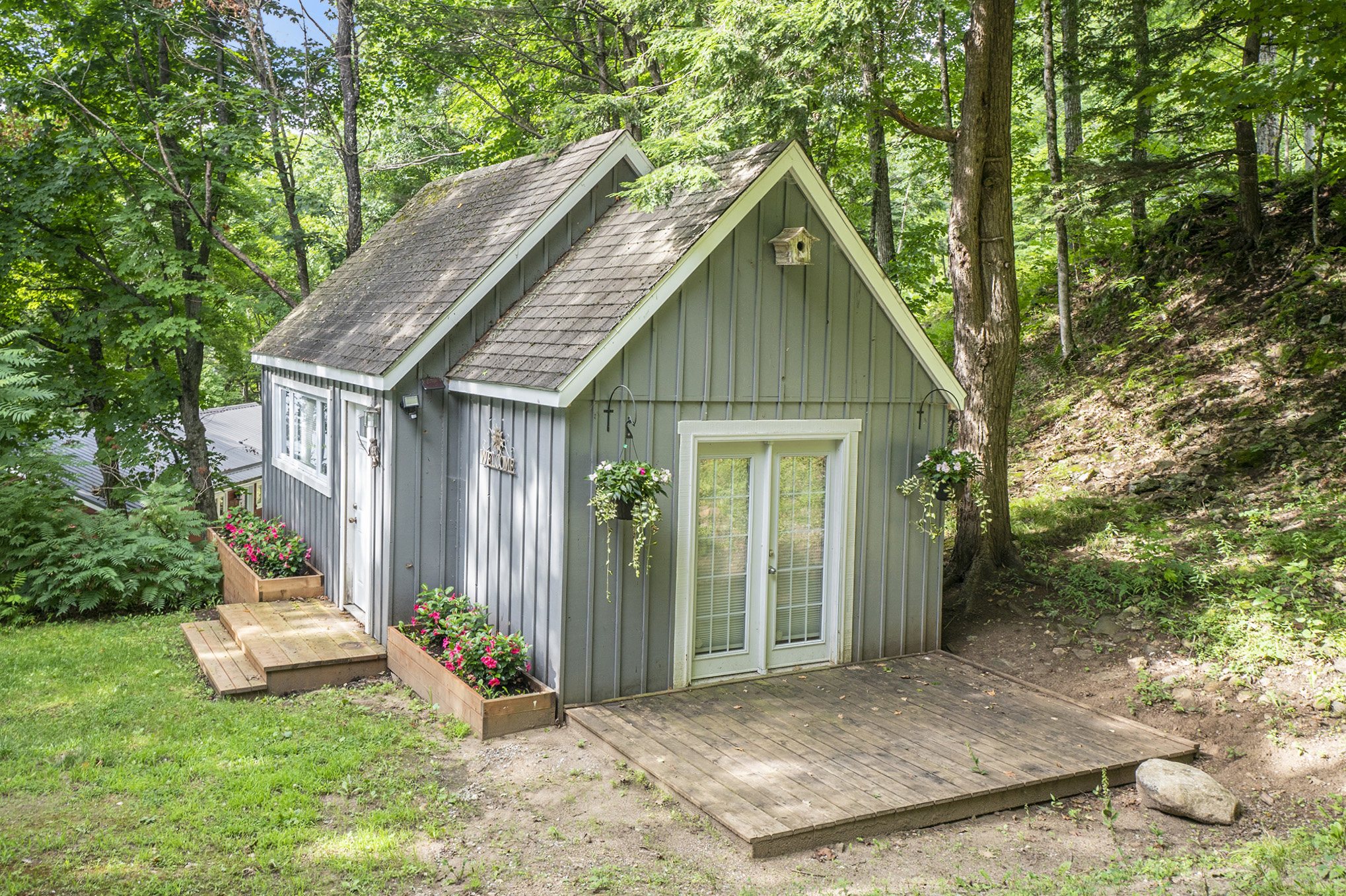 Charming bunkie surrounded by forest, offering a private retreat for guests or kids