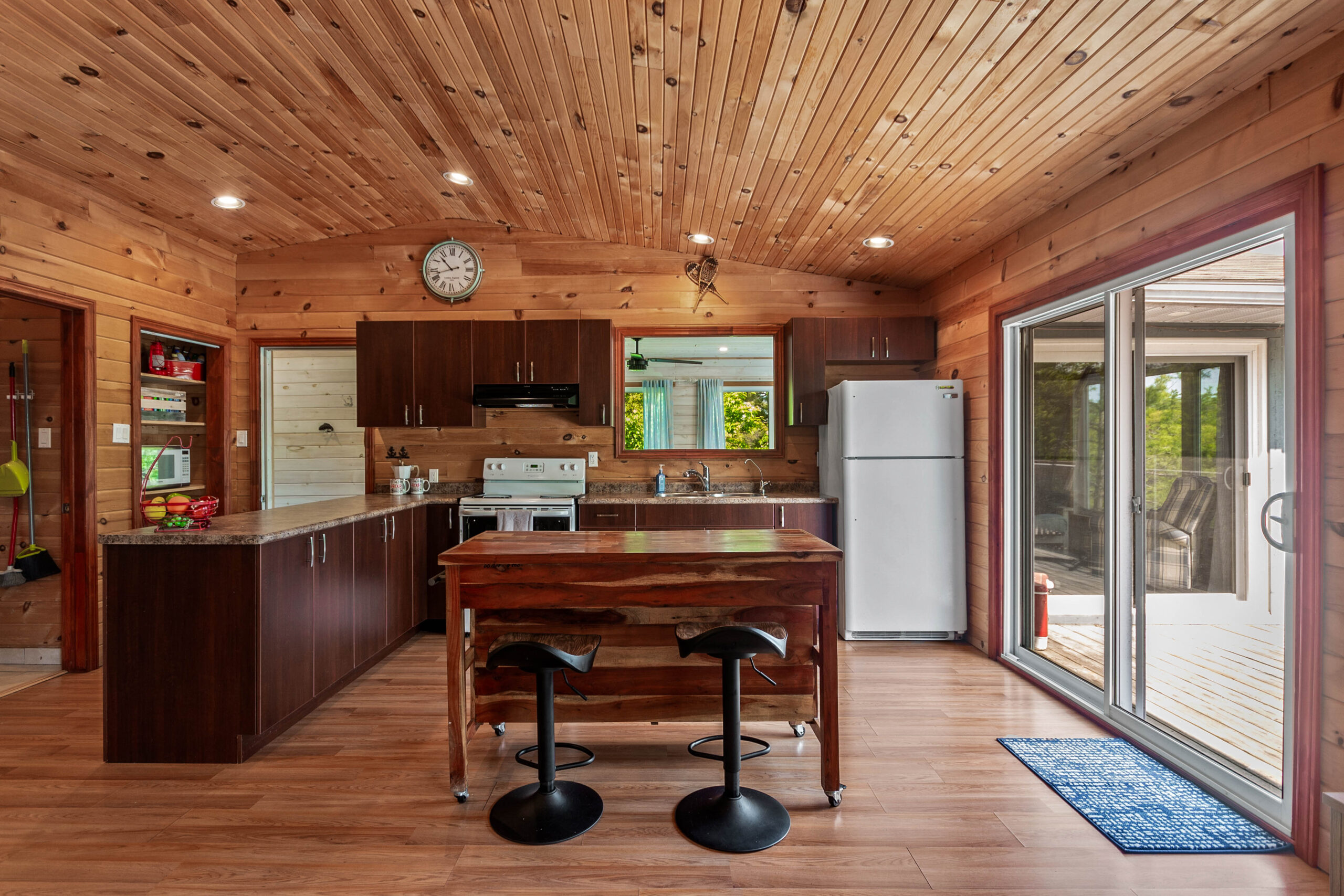 A dark wood-paneled kitchen