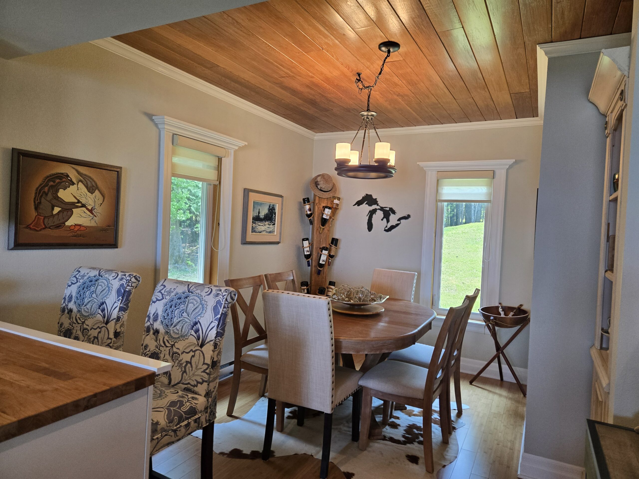 Warm-toned dining space with wood ceiling and cozy lighting