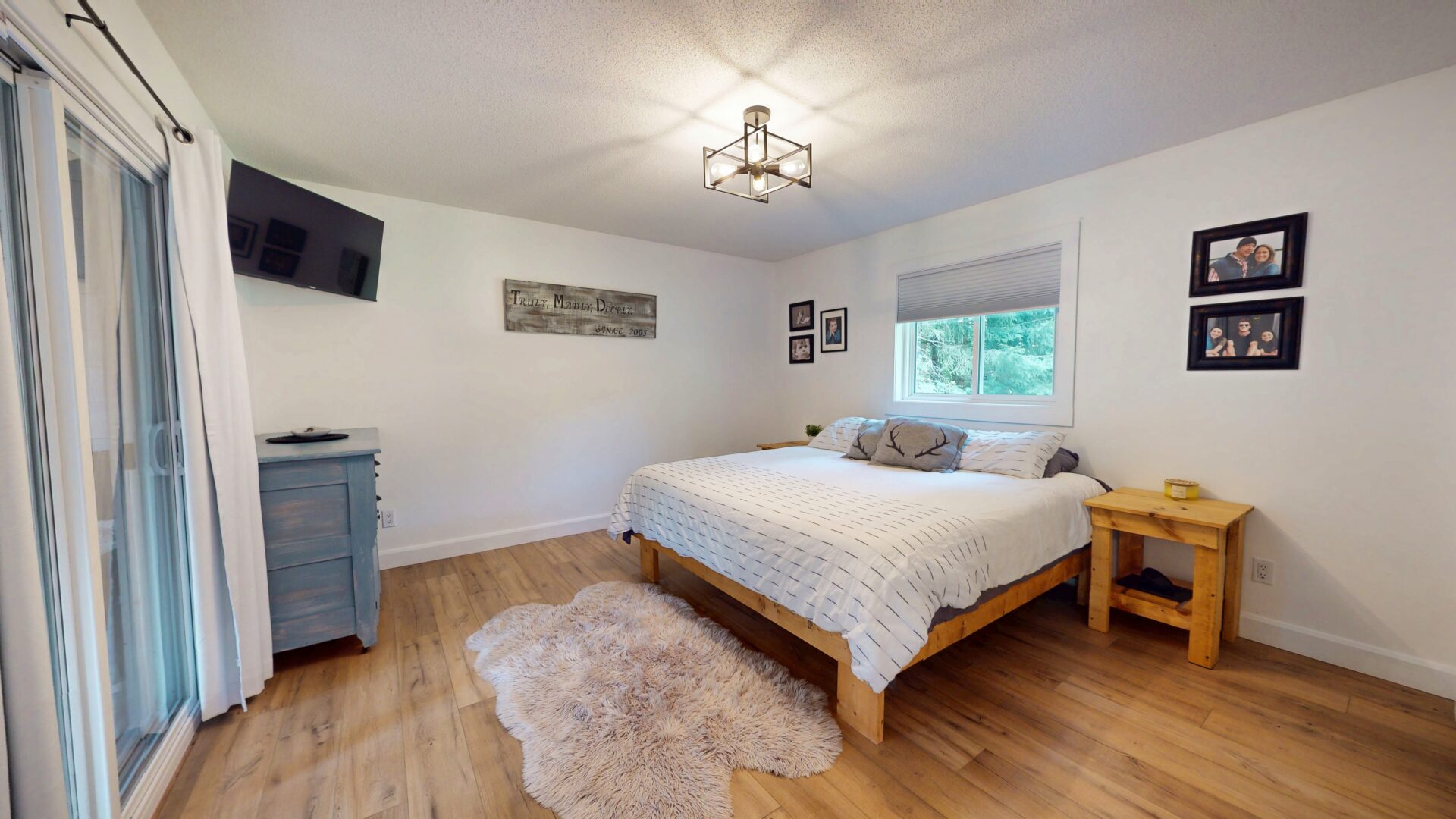 A white bed in a white bedroom