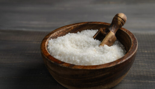 A wooden bowl of kosher salt
