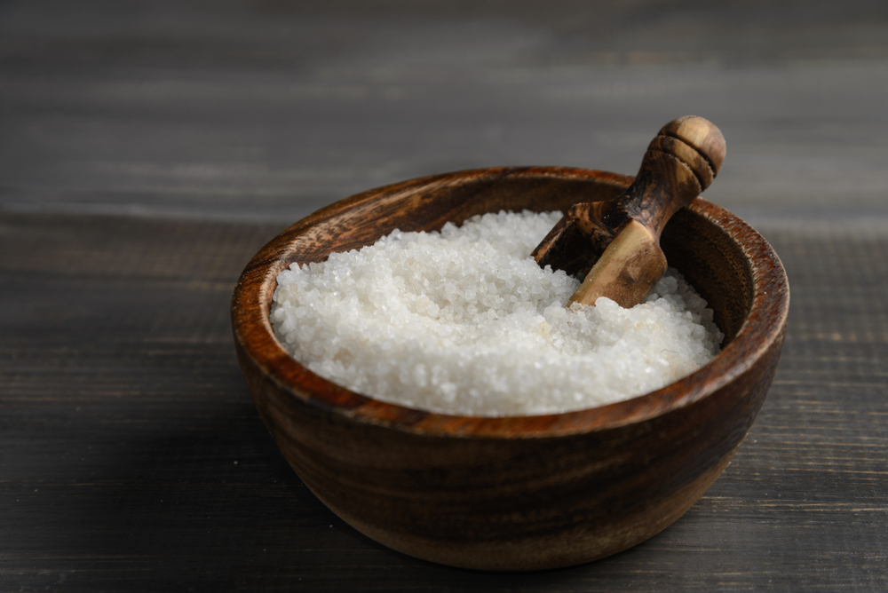 A wooden bowl of kosher salt