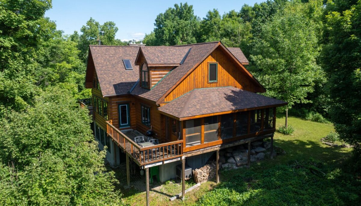 A log cabin nestled in the woods