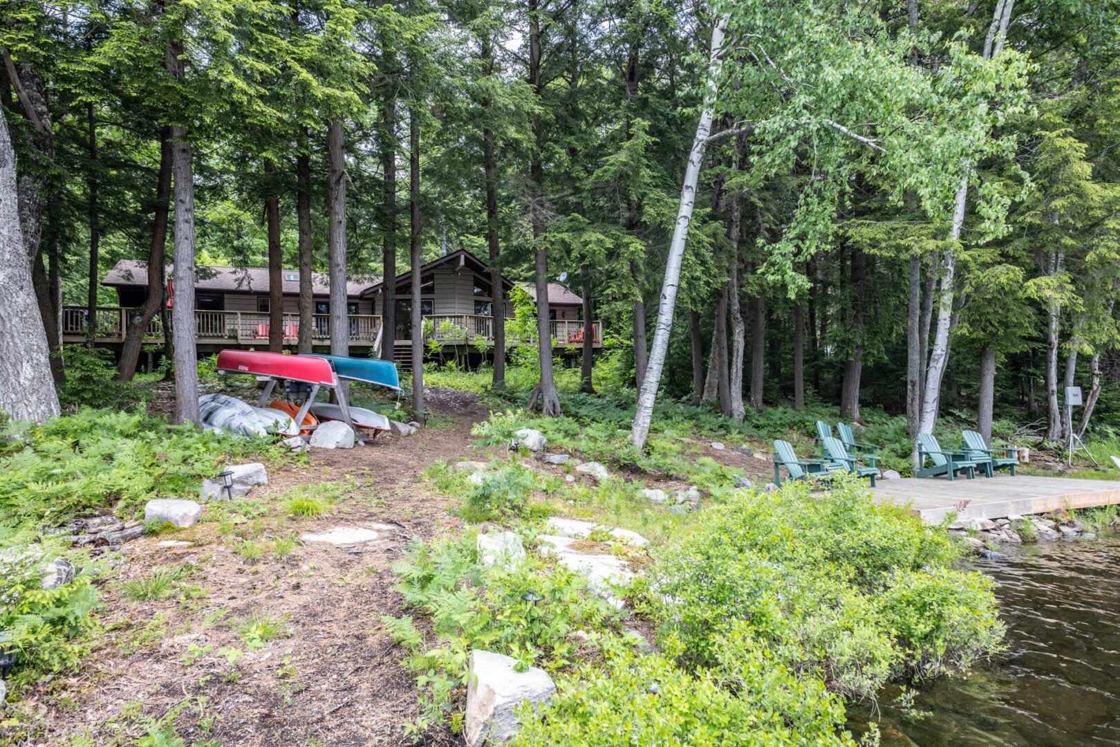 A cottage nestled behind trees