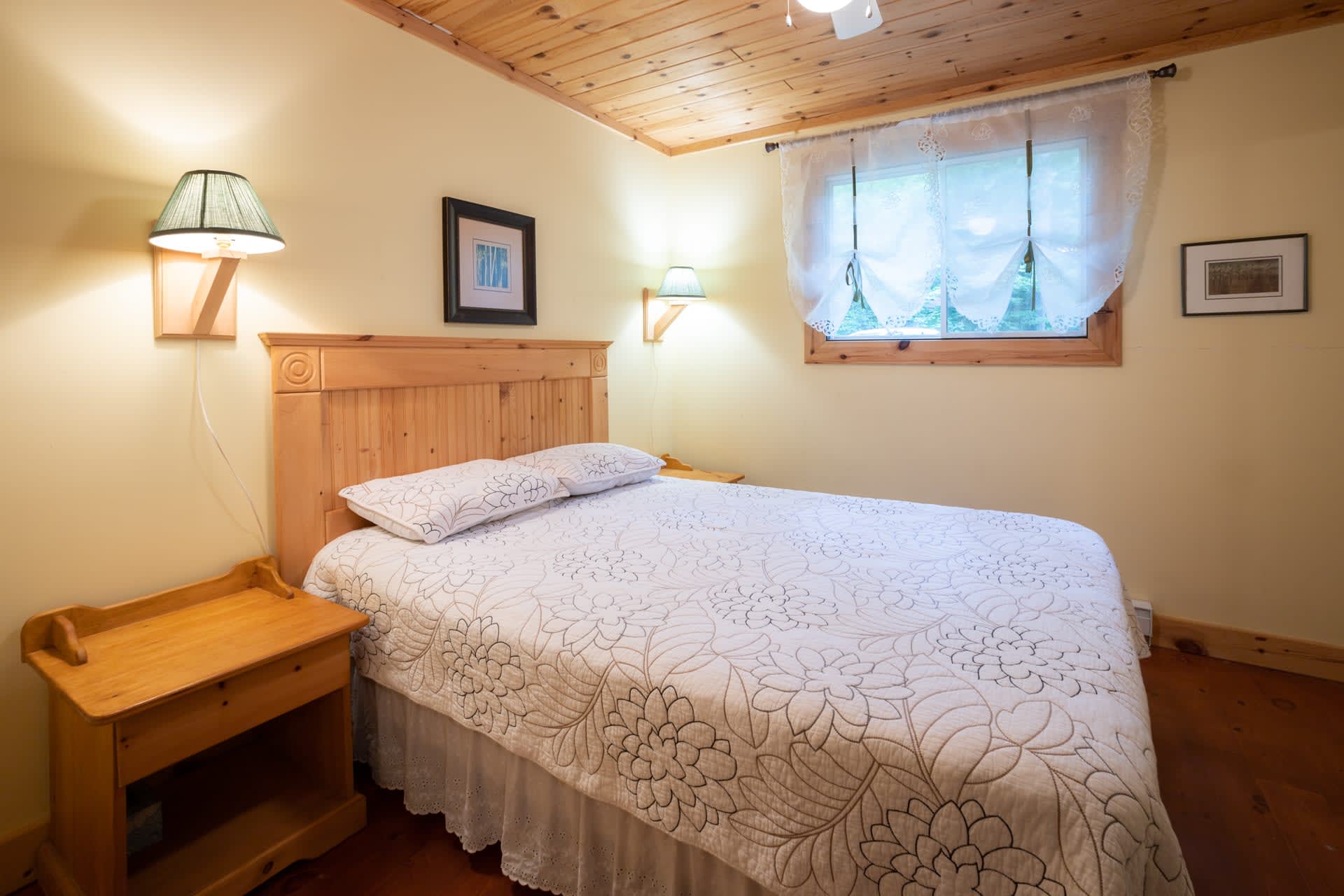 A white bed in a white bedroom