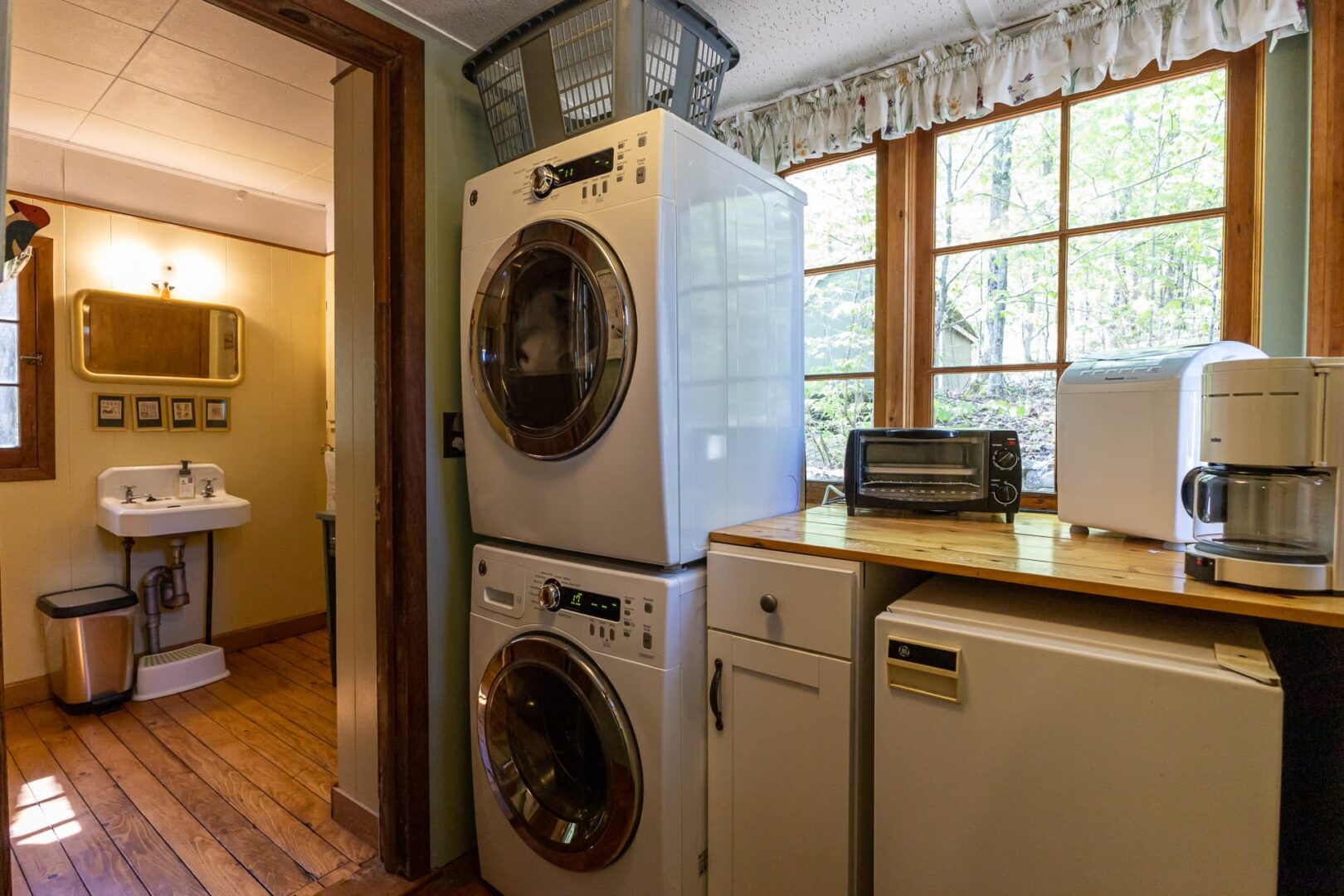White laundry machines stacked on top of each other