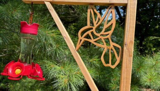 A hummingbird feeder holder