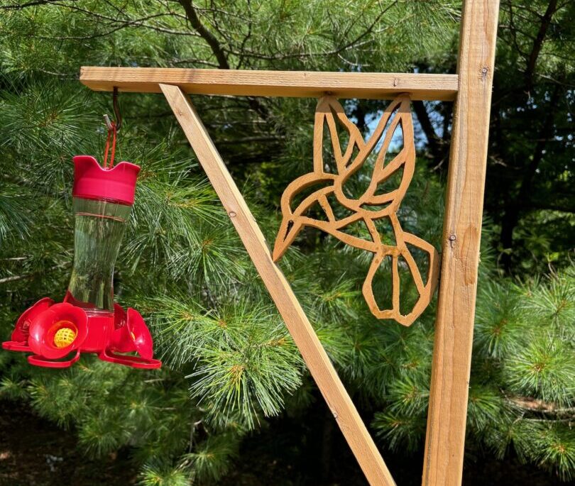 A hummingbird feeder holder